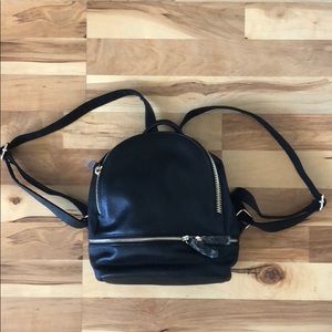 Mini black and gold backpack